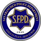 A blue and white police badge with the words san francisco police department in gold.